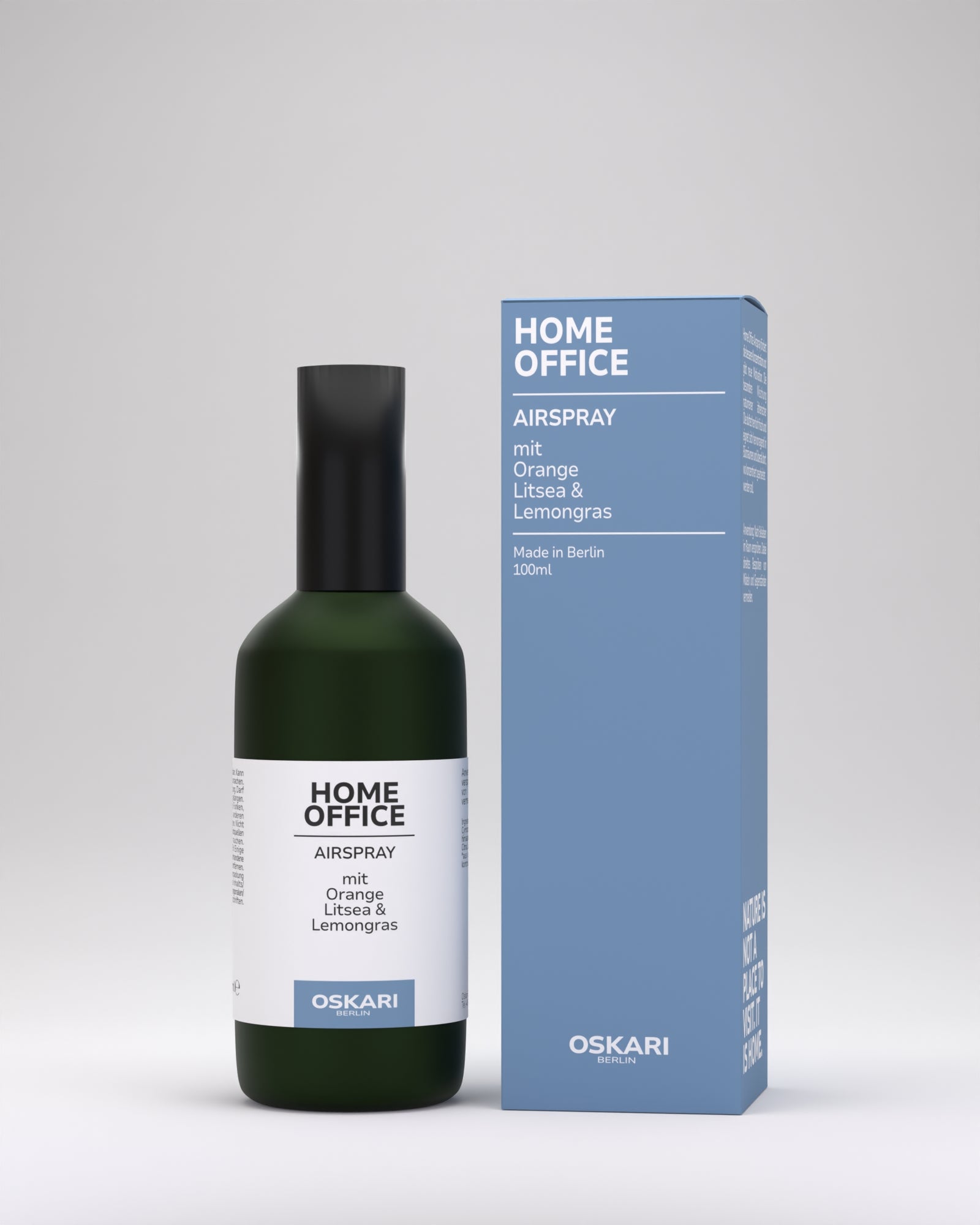 Home Office Raumspray mit schwarzer Kappe und nebenblauer Schachtel stehend vor hellem Hintergrund