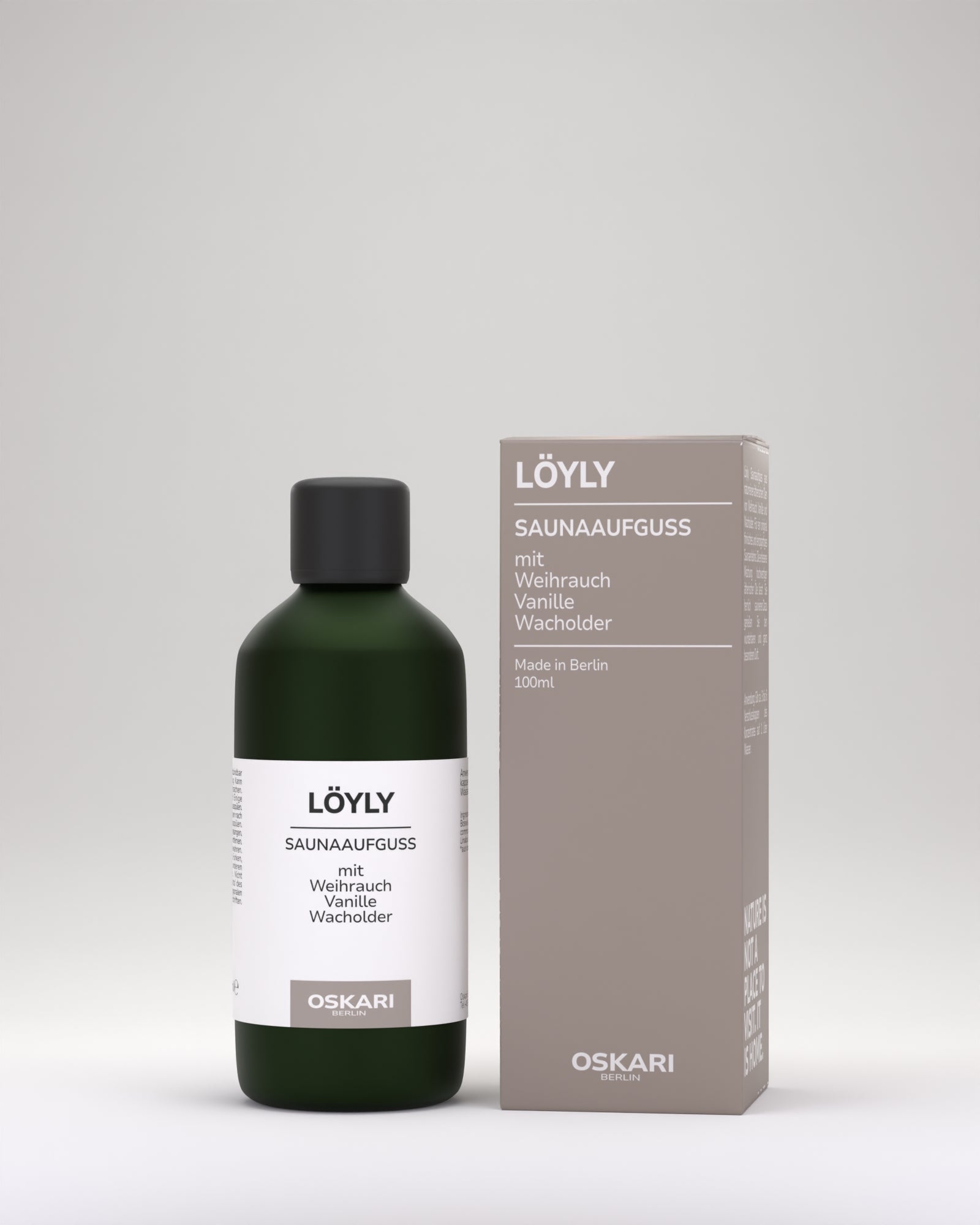 Löyly natürlicher Saunaaufguss von Oskari in edler grauer Schachtel daneben stehend die elegante matte grüne Flasche mit weissem Etikett